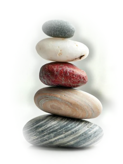 Pale stones stacked in raking daylight